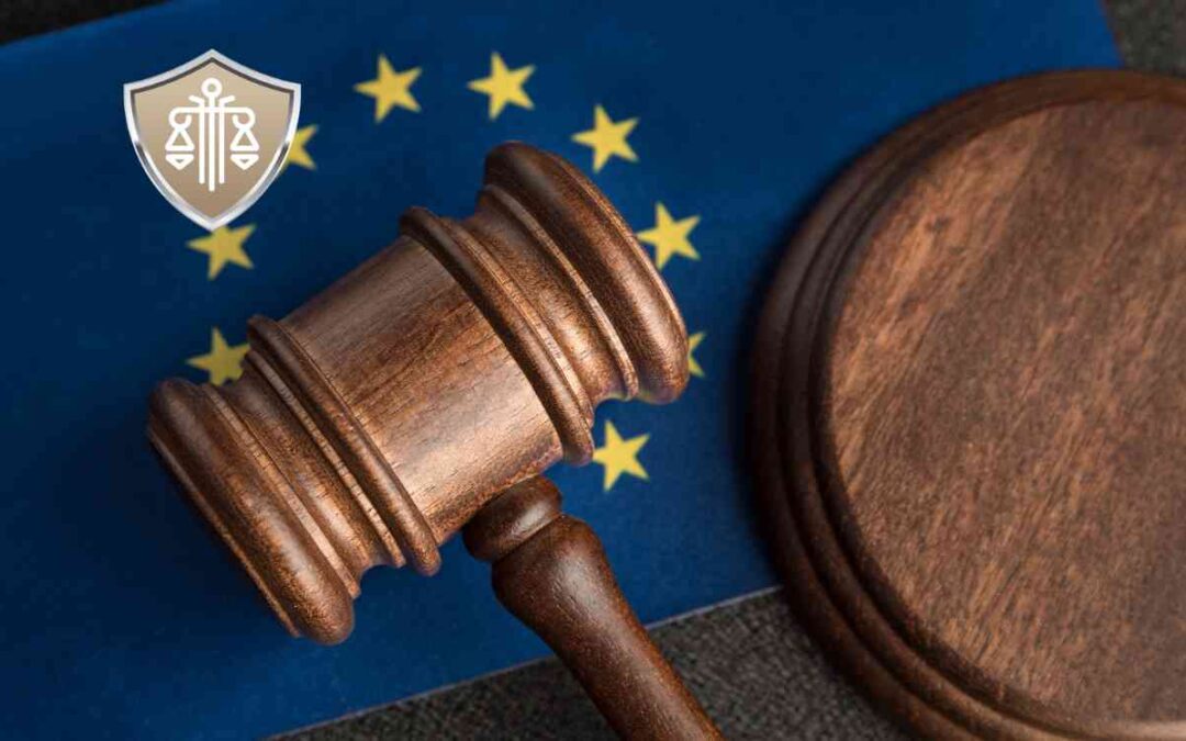 Judicial gavel resting on a European Union flag with yellow stars on blue background, symbolizing EU law.